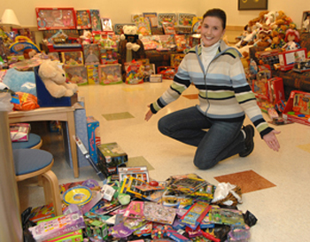 Former patient Julie Passon brought nearly 500 presents to the pediatric clinic.