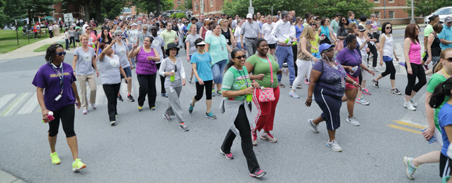 a large group of people walking and running at the NIH campus