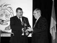 Photo of Dr. Goldspiel 
                receiving his award