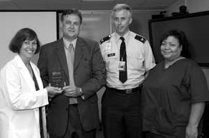 Photo of Dr. Letiman receiving her award