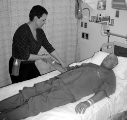 Photo of Joanie Hartment with a patient
