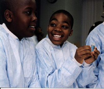 photo of a young boy smiling while participating in one of the activities