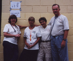 group photo of Elain Ruiz, Ellen Vaughan, Dr. Bibi Bielekova and Dr. John Hurley