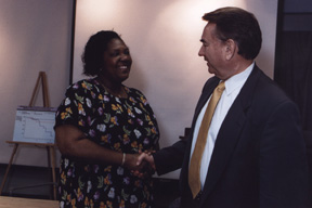 photo of Secretary Thompson shaking the had of Angela Richardson