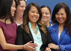 Nina Pham, the first patient diagnosed with Ebola to be treated at the Clinical Center, joins her sister, mother and NIH doctors, nurses and senior leaders to celebrate her discharge