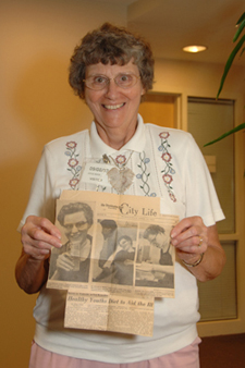 Joyce Bohn displays a Washington Post article from 1957 describing her experience as a healthy volunteer in NIH protocols.  