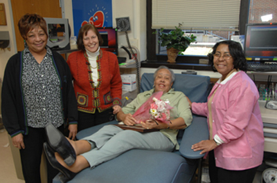 Rosa Lee Powell at her 100th whole blood donation with DTM staff.
