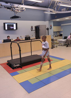 a patient walks in the Clinical Movement Analysis Lab