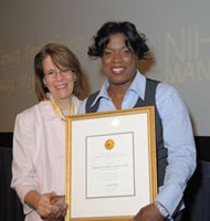 award winner Marlene with NPCS chief Dr. Hastings