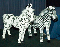 Stuffed animal horses and zebras