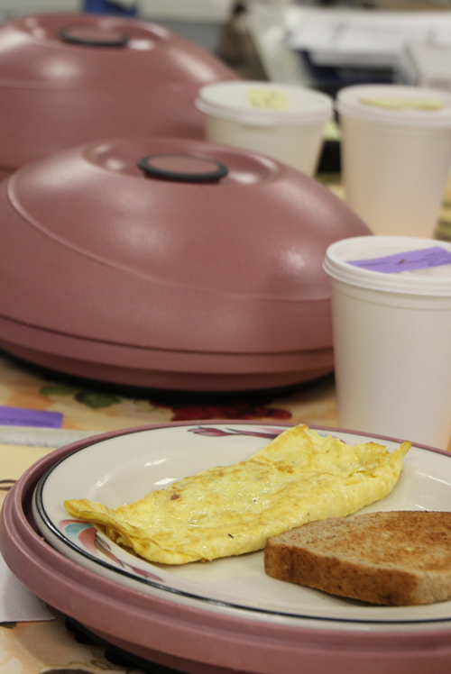 A breakfast plate with an egg omelette and toast