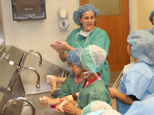 Children prepare for a mock surgery