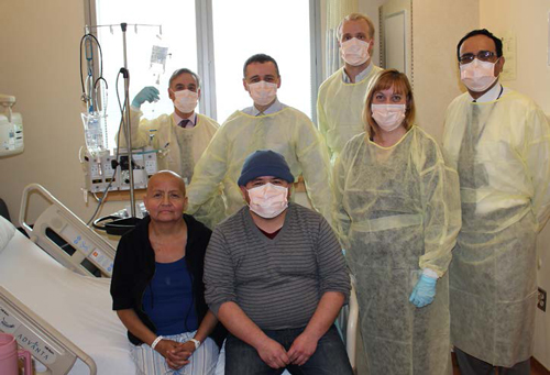 patient Leticia Gutierrez (front left), her brother, and medical team
