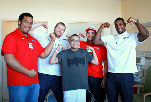 Uplifting Athletes visit Darious Gallegos, a pediatric patient, at the NIH Clinical Center on Feb. 29, 2016, as part of the NIH Rare Disease Day.