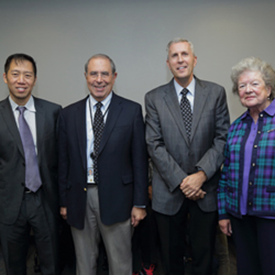 Left photo: Dr. Michael Kuo, Dr. John I. Gallin, Dr. David Bluemke, and Mrs. Anne-Marie Doppman. Right photo: Bluemke presenting Kuo with a certificate of appreciation