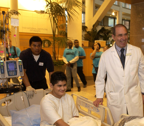 Dr. John I. Gallin (right) welcomes patient Marcos Arrieta to the pediatrics unit in the new Hatfield Clinical Research Center April 2, 2005.