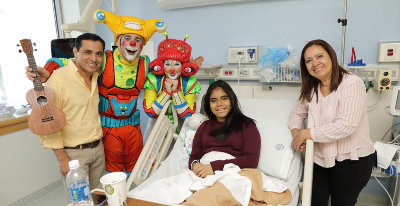 Laughter was the best medicine as two Ringling Bros. and Barnum & Bailey Circus clowns give a ringside performance to a cancer patient and her family at the NIH Clinical Center during the clowns' visit.