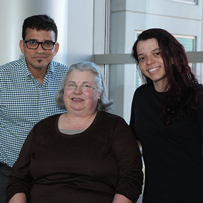 Yogesh Kalotra (left), Deborah Crawford (center) and Natalia Sampaio Moura volunteer with the NIH Clinical Center's Volunteer Program