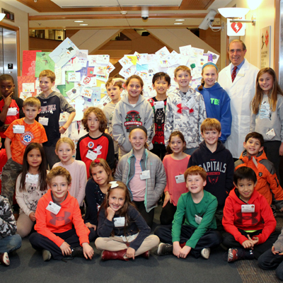 Dr. John I. Gallin and fifth graders from Bethesda's Carderock Springs Elementary School