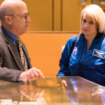 Clinical Center CEO Dr. James Gilman shows NASA astronaut–scientist Dr. Kate Rubins a model of the hospital
