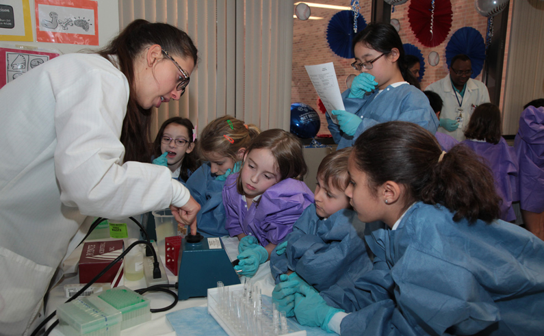Children participate in laboratory medicine demonstration