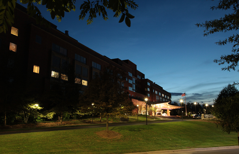 Exterior view of the north entrance of the NIH Clinical Center. Continuous coordination and open communication allow employees to focus on the mission at all hours.