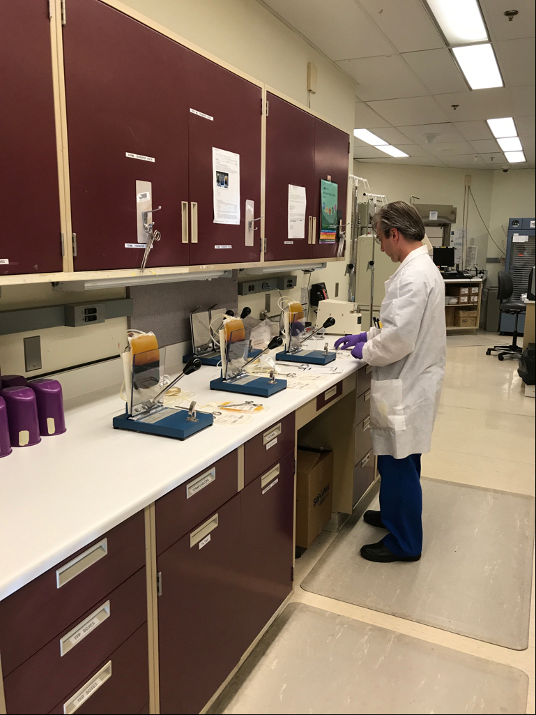 Nathan Marchiano, with the Department of Transfusion Medicine, is preparing to make several blood components during the night shift at the NIH Clinical Center Sept. 28