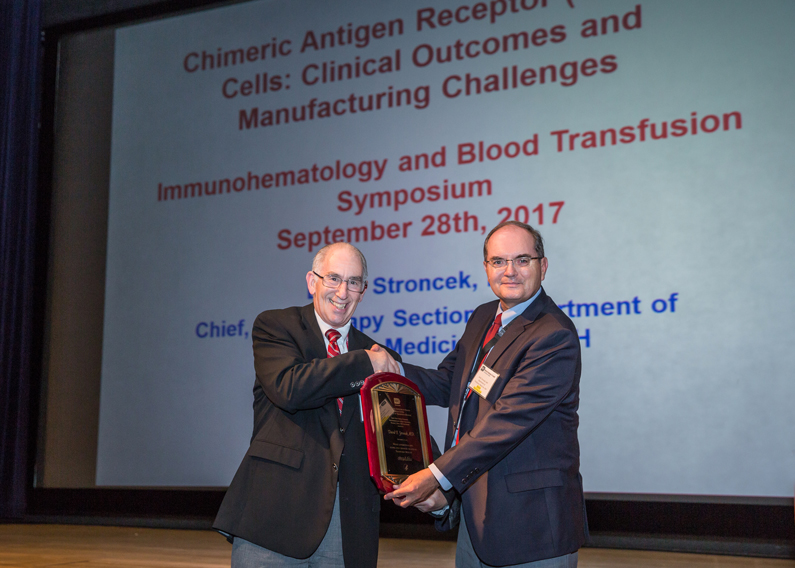 Dr. Harvey G. Klein of the NIH Clinical Center Department of Transfusion Medicine presents the Richard J. Davey Award to Dr. David F. Stroncek