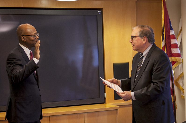Pius Aiyelawo swearing into the Senior Executive Service with Dr. Lawrence Tabak