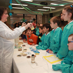 Teresa Bauch showing children cultures of infectious diseases on Take Your Child to Work Day