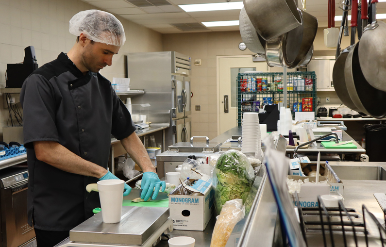 The metabolic kitchen staff creating precisely measured ultra-processed and unprocessed meals for study participants