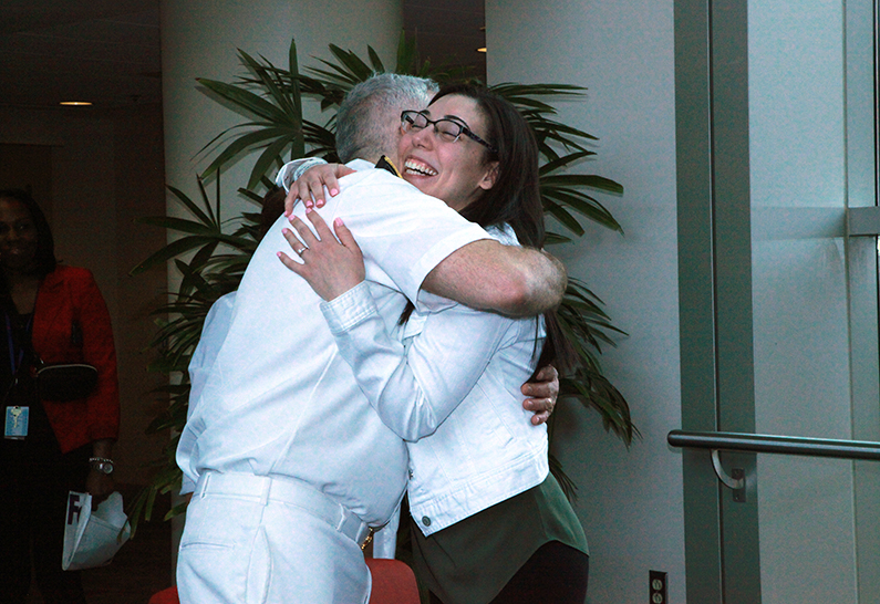 Marissa Amuso hugs her care provider, Dr. Richard Childs