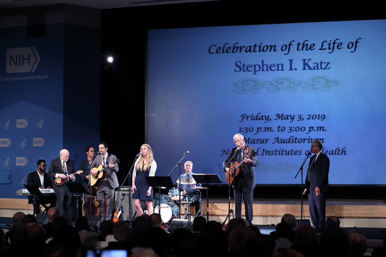 NIH musical group led by Dr. Collins performing on stage
