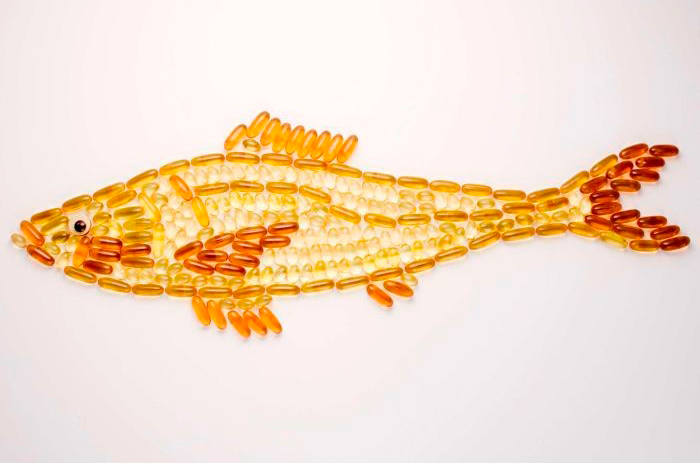 a fish shape made out of pills and vitamins