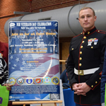 Ingrid Harris, Mitzi Kosciulek and Richard Appling pose with two Marines during NIH's 8th Annual Veterans Day Celebration Nov. 12