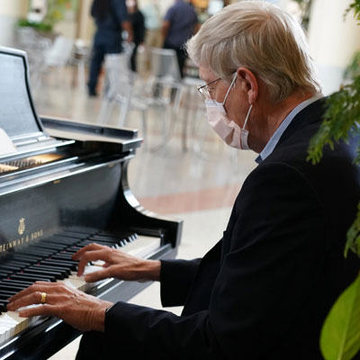 Francis Collins playing piano in June 2020