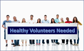 a group of people smiling and holding a sign that reads Healthy Volunteers Needed