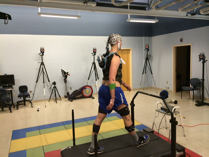 a participant walking on the active treadmill while EEG is recorded